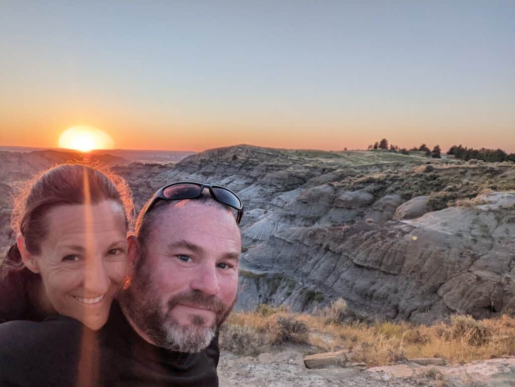 Kris and Katie Kimball overlooking a sunset